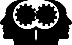 Two heads back to back with a cog between them