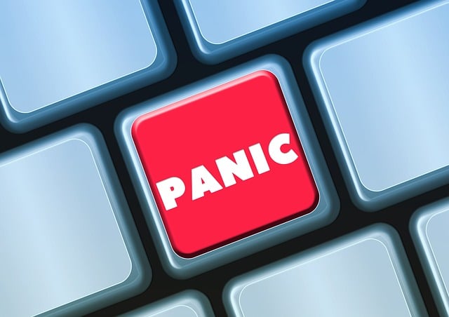 Red panic button on a PC keyboard